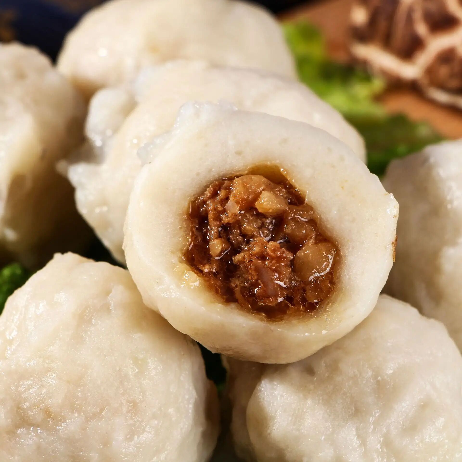 A close-up of a food item with a visible filling.