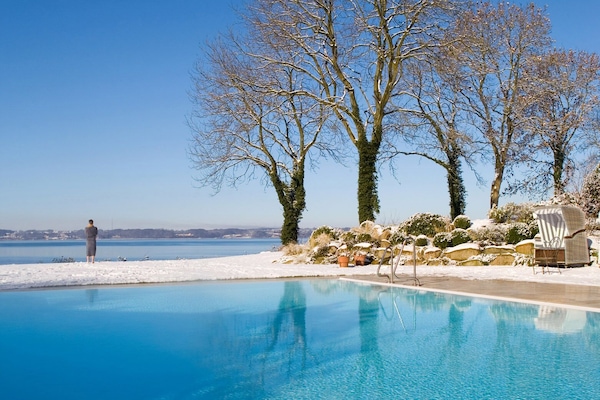 Indoor pool, outdoor pool, pool umbrellas, sun loungers