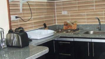Condo, 2 Bedrooms | Private kitchen | Full-size fridge, microwave, stovetop, coffee/tea maker