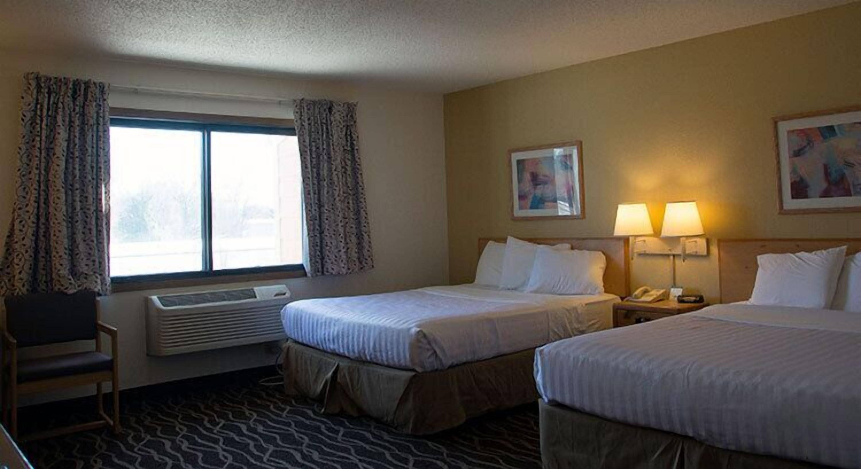 room, two queen beds, non smoking | desk, blackout curtains, iron/ironing board, free cots/infant beds