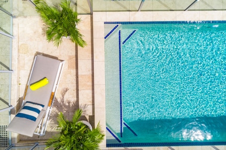 2 outdoor pools, open 9:00 AM to 9 PM, pool umbrellas