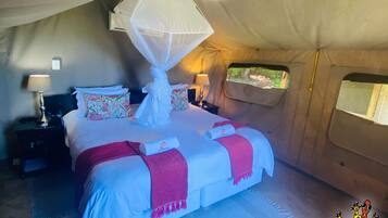 Luxury Tent, Shared Bathroom, River View | In-room safe, desk, blackout curtains, iron/ironing board