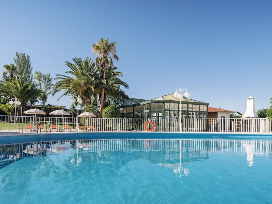 Seasonal outdoor pool, pool umbrellas, pool loungers