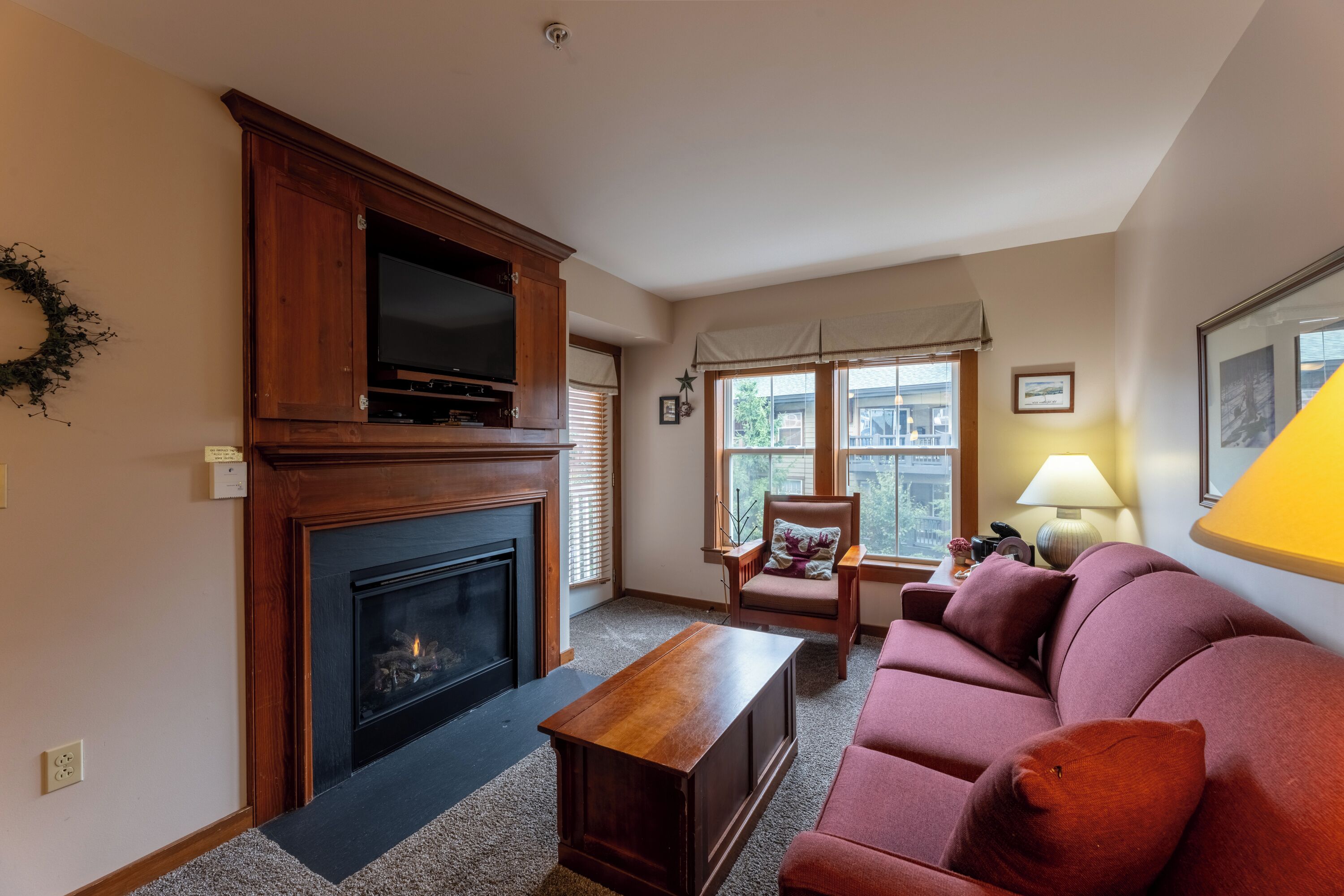 condo | living area | 1-inch tv with cable channels, fireplace