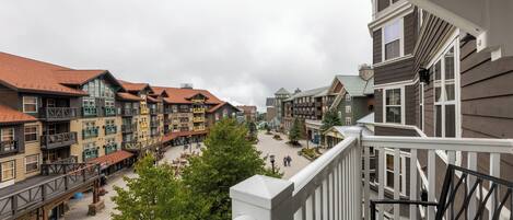 A multi-story building with balconies and a central courtyard.
