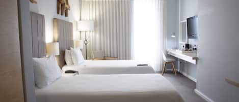 Habitación con 2 camas individuales | Ropa de cama de alta calidad y camas Select Comfort