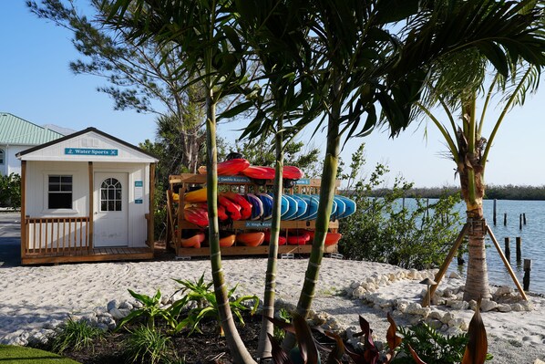 A small building labeled "Water Sports" with kayaks and a paddleboard.