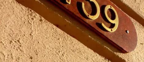 A wooden house number plaque with the number 1739.