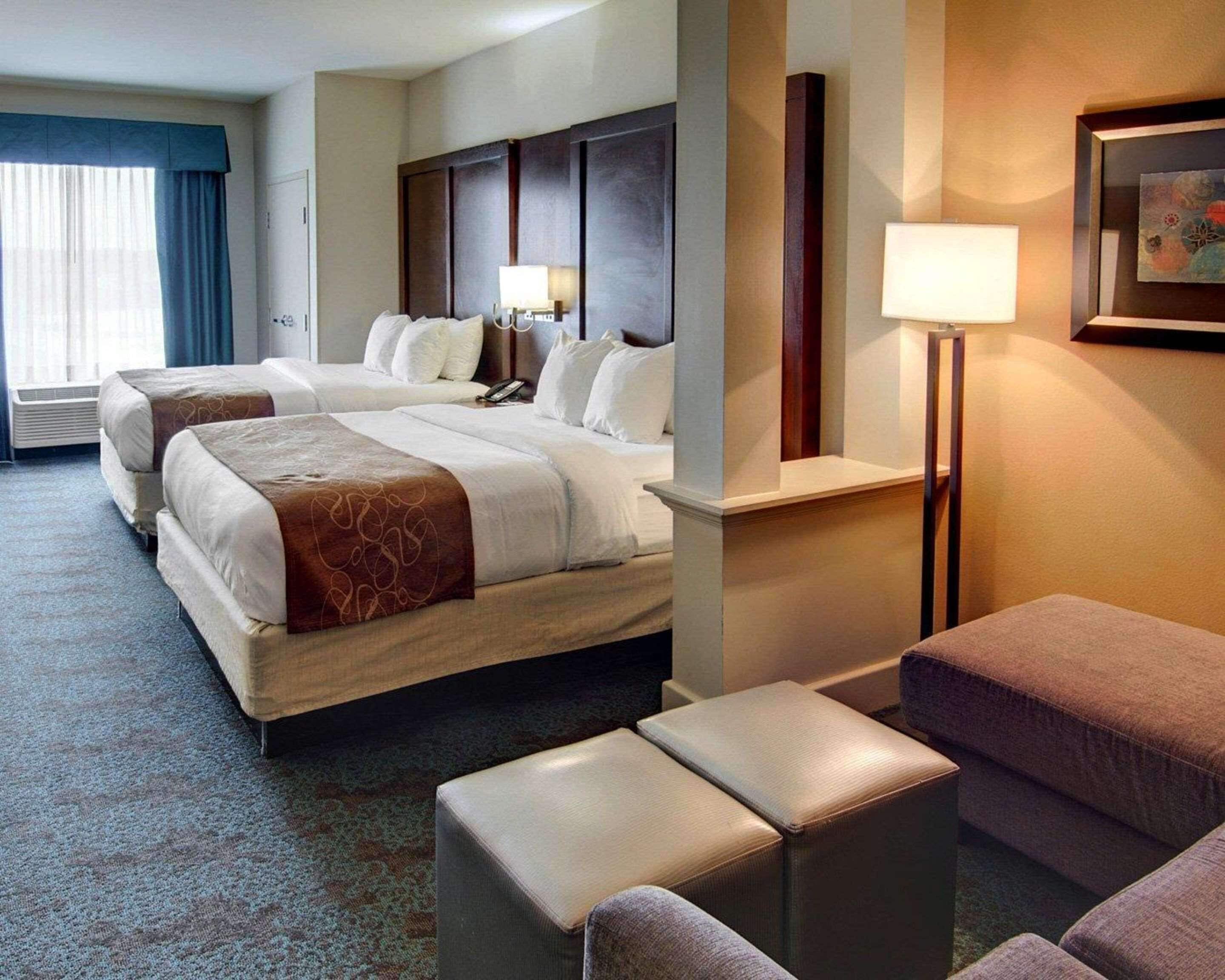 Premium bedding, desk, laptop workspace, blackout curtains