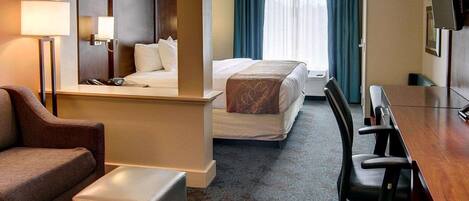 Premium bedding, desk, laptop workspace, blackout drapes