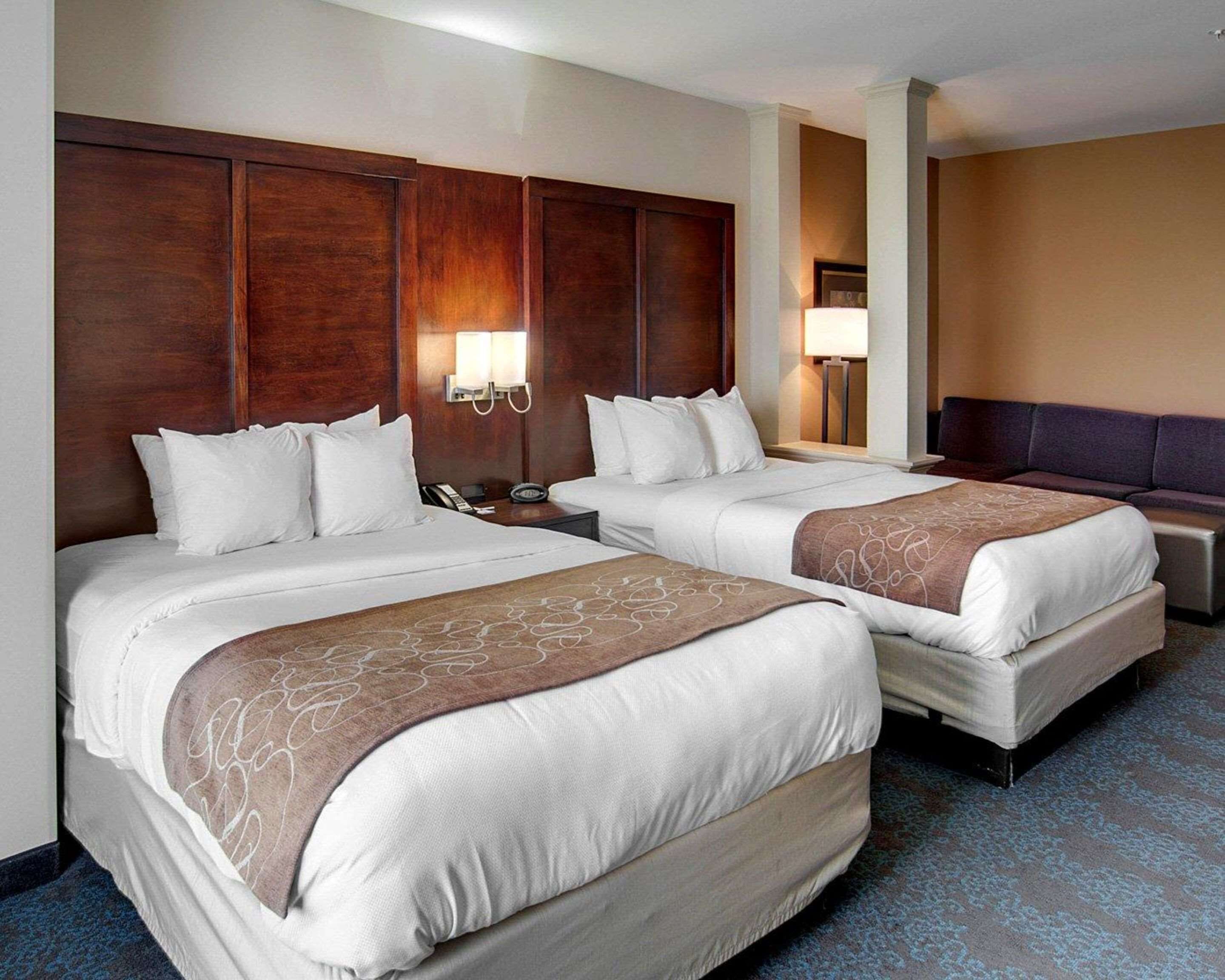 Premium bedding, desk, laptop workspace, blackout curtains