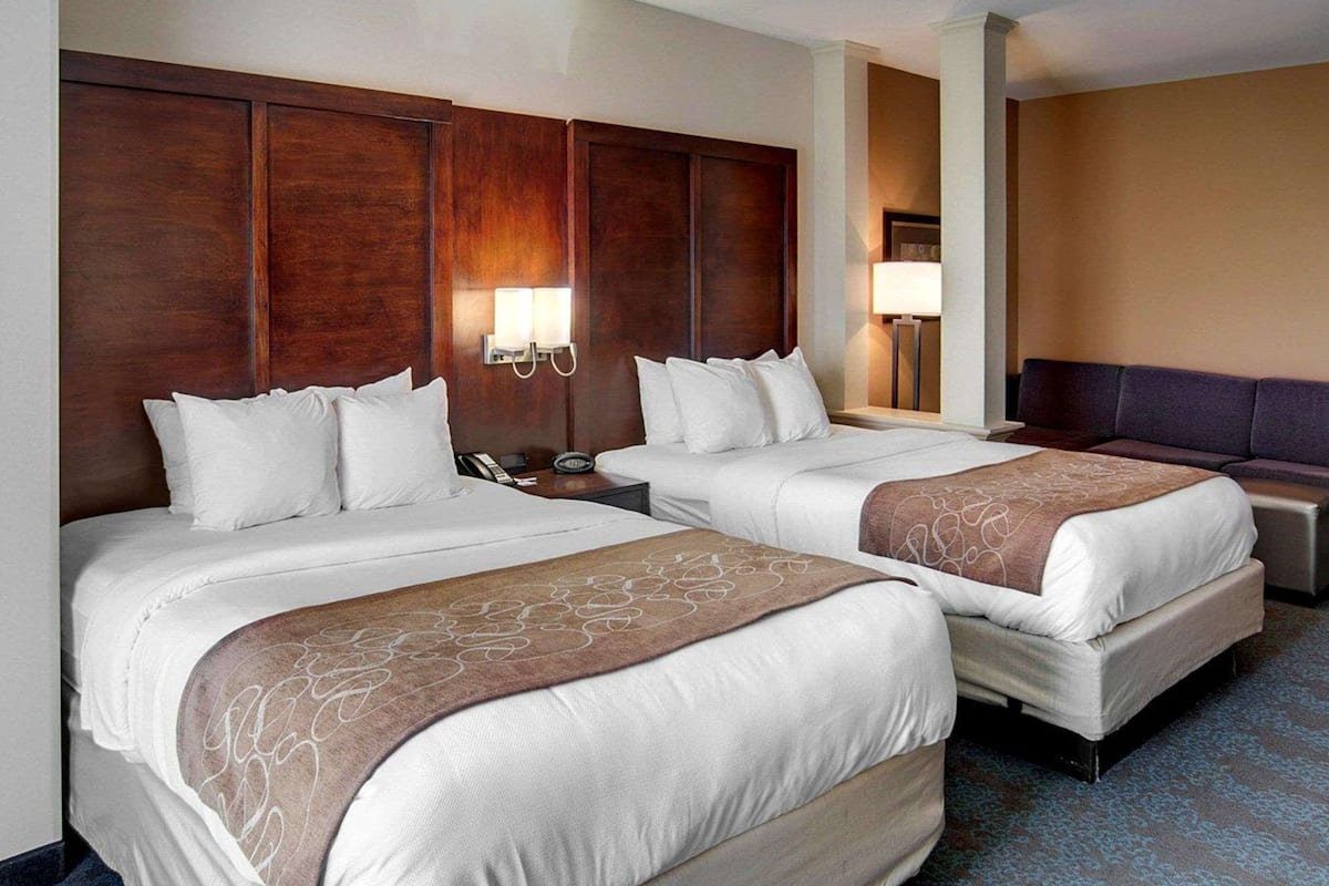 Premium bedding, desk, laptop workspace, blackout curtains