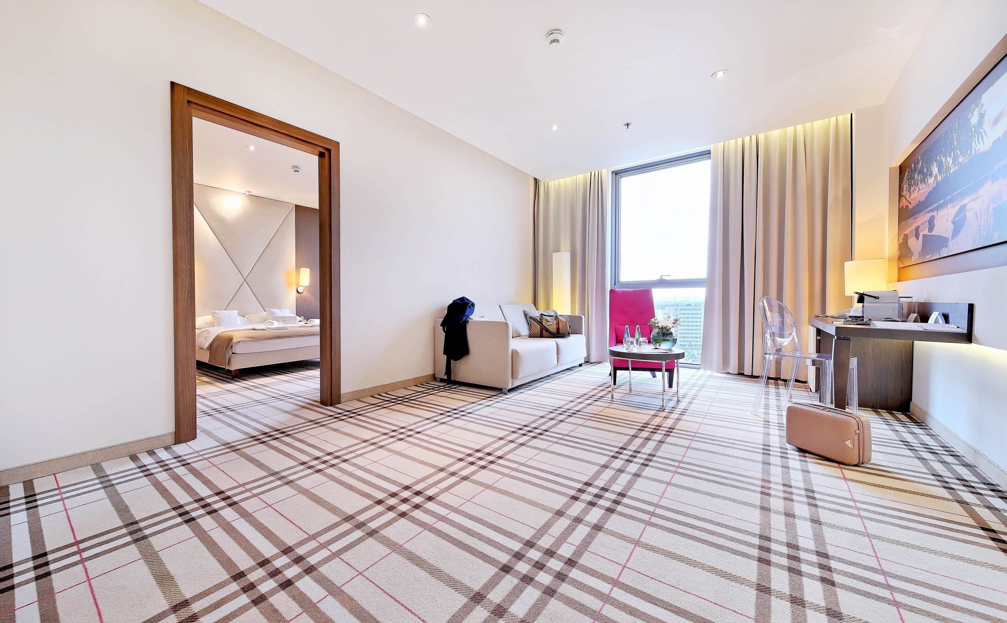 deluxe double or twin room | living area | 32-inch flat-screen tv with satellite channels, tv