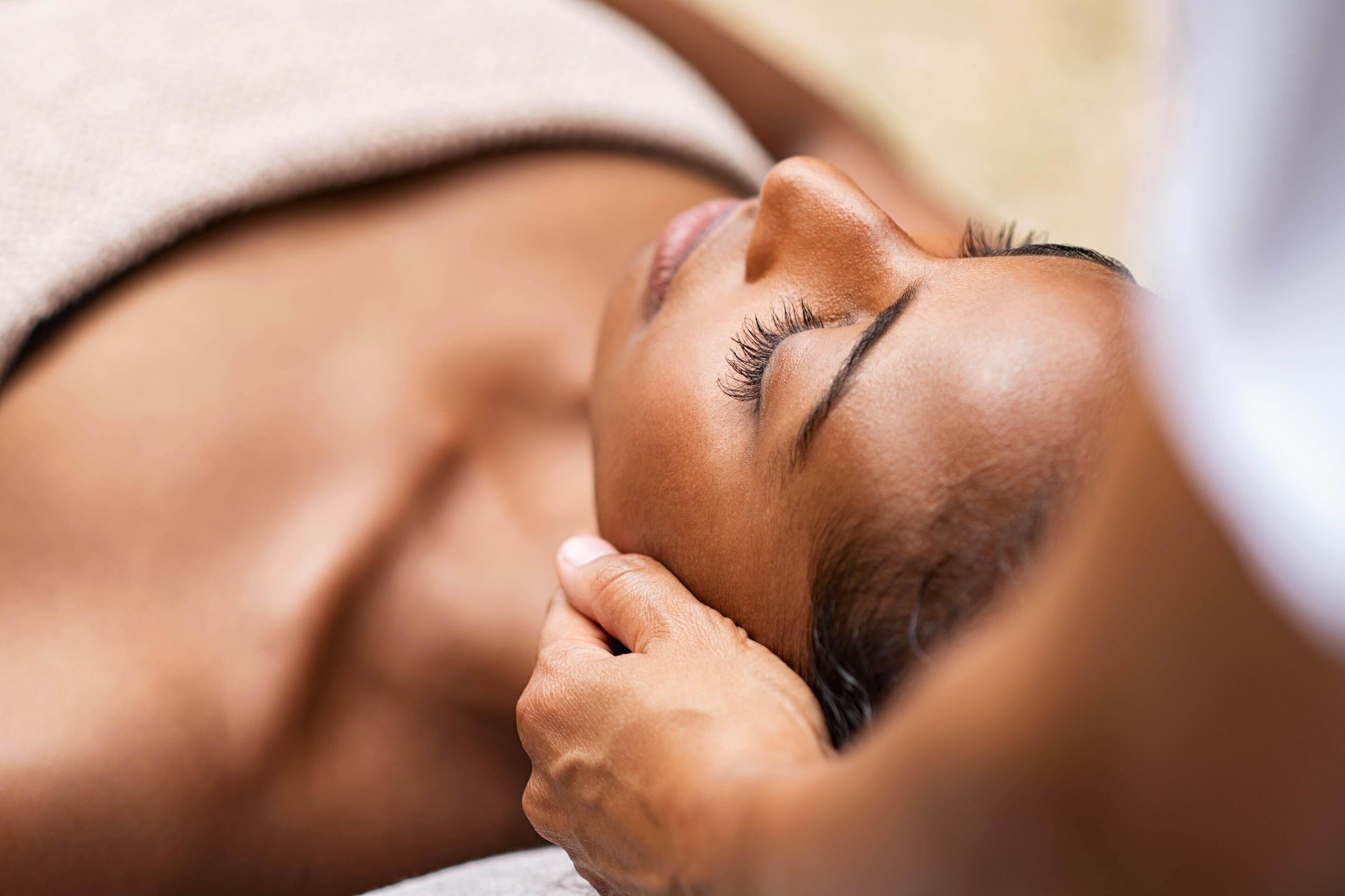 A close-up of a person receiving a massage.