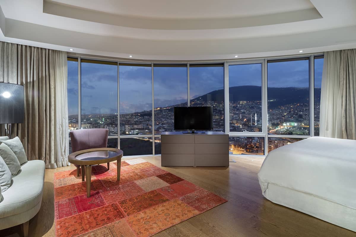 presidential suite, 1 bedroom | living area | 40-inch flat-screen tv with cable channels, tv, pay films