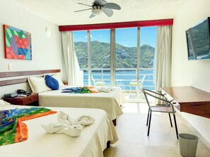 豪華四人房, 海景 | 房內夾萬、遮光窗簾/窗簾、免費 Wi-Fi、床單