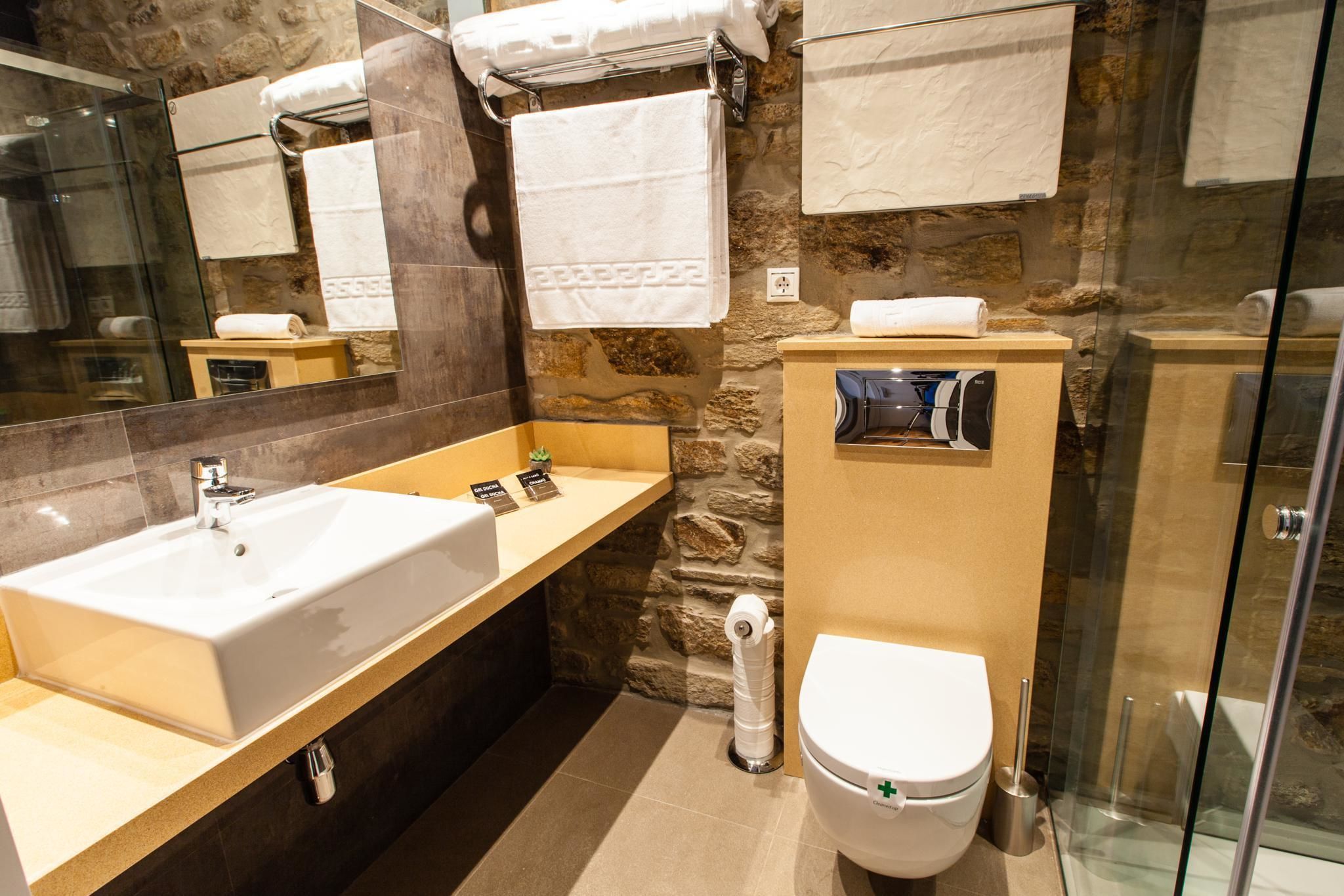 shower, designer toiletries, hair dryer, towels