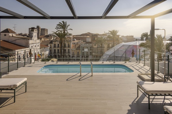 Seasonal outdoor pool, pool loungers
