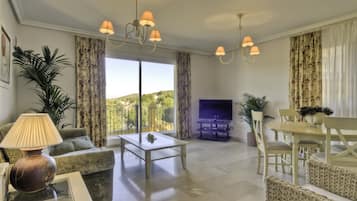 Premium Apartment, 2 Bedrooms | Living room | Flat-screen TV