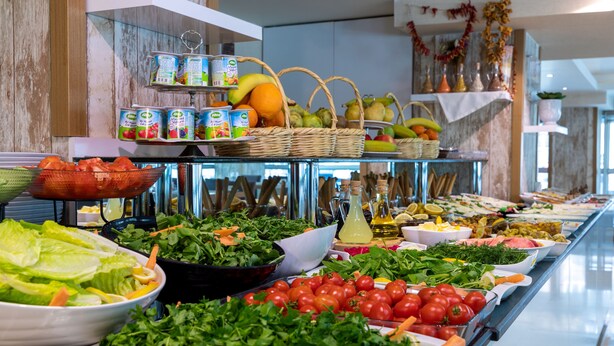 A buffet with various food items including salads, fruits, and beverages. - Dies Hotel (Diyarbakir)
