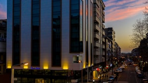 A hotel with a modern facade, large windows, and a prominent sign. - Dies Hotel (Diyarbakir)