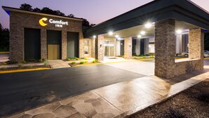 A Comfort Inn hotel entrance with a stone facade, a covered parking area, and a well-lit driveway. - Comfort Inn Kings Mountain (Kings Mountain)