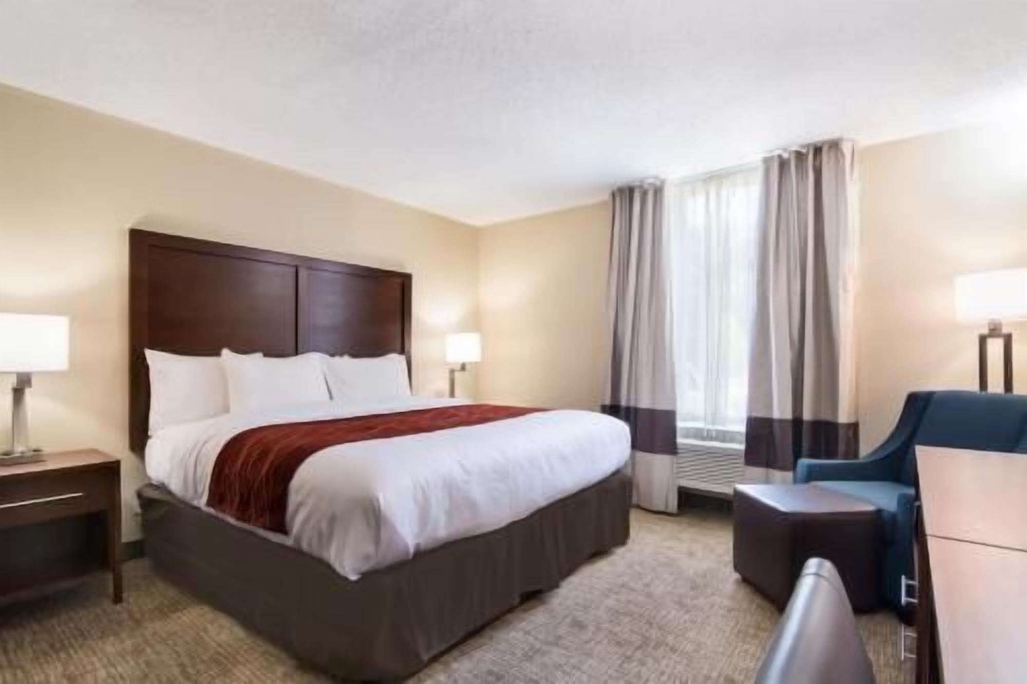 Desk, laptop workspace, blackout drapes, iron/ironing board