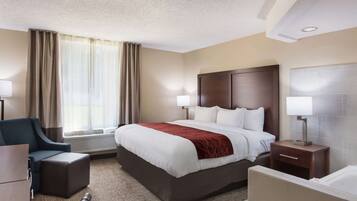 Room, 1 King Bed, Non Smoking, Jetted Tub | Desk, laptop workspace, blackout drapes, iron/ironing board