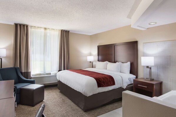 Room, 1 King Bed, Non Smoking, Jetted Tub | Desk, laptop workspace, blackout drapes, iron/ironing board