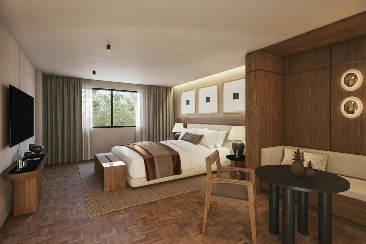 Ropa de cama de alta calidad y caja de seguridad en la habitación