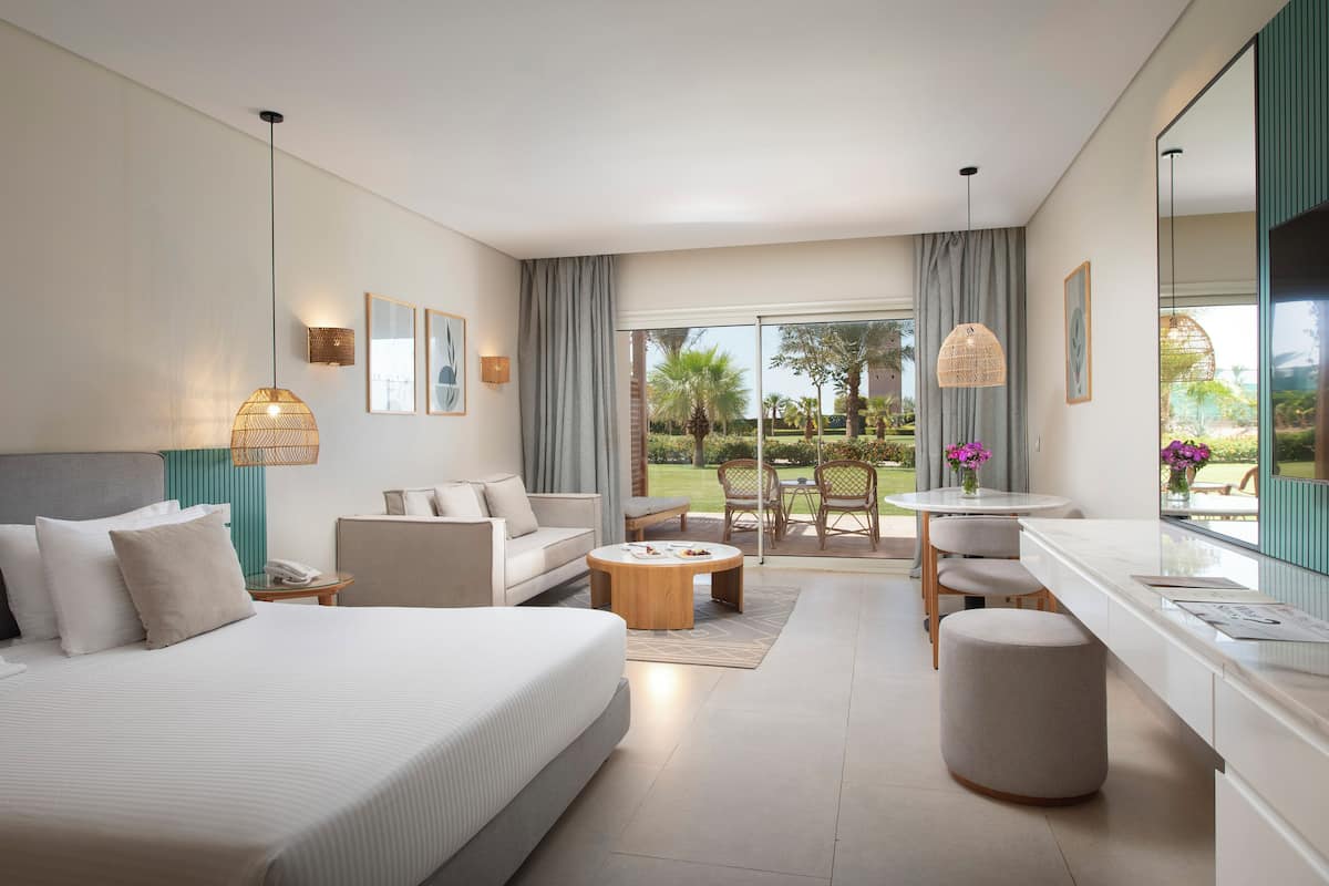 Comfort Room - West Bay (Adults Only) | Minibar (some free items), in-room safe, desk, blackout drapes