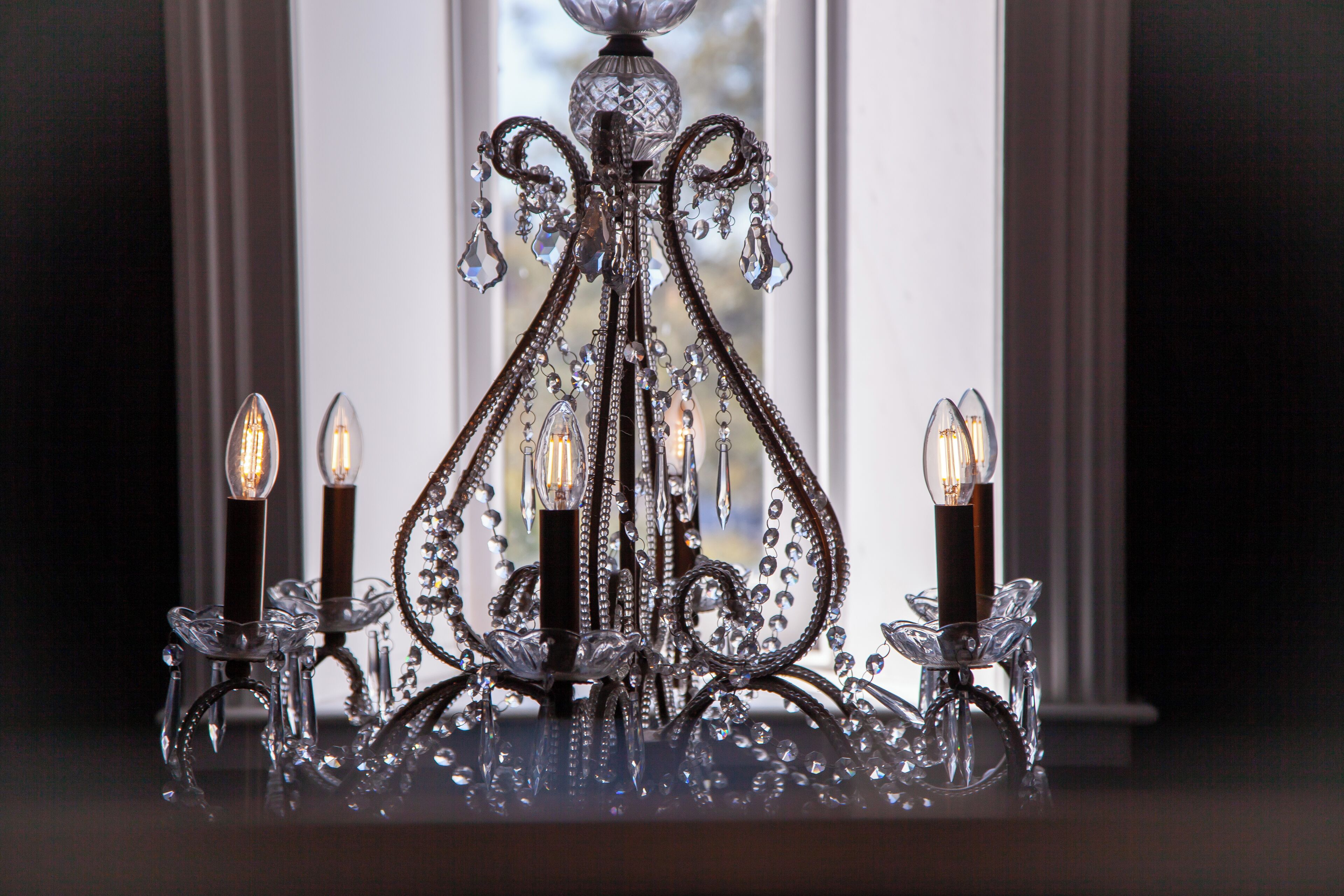 A chandelier with multiple candle holders.