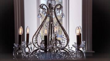 A chandelier with multiple candle holders.