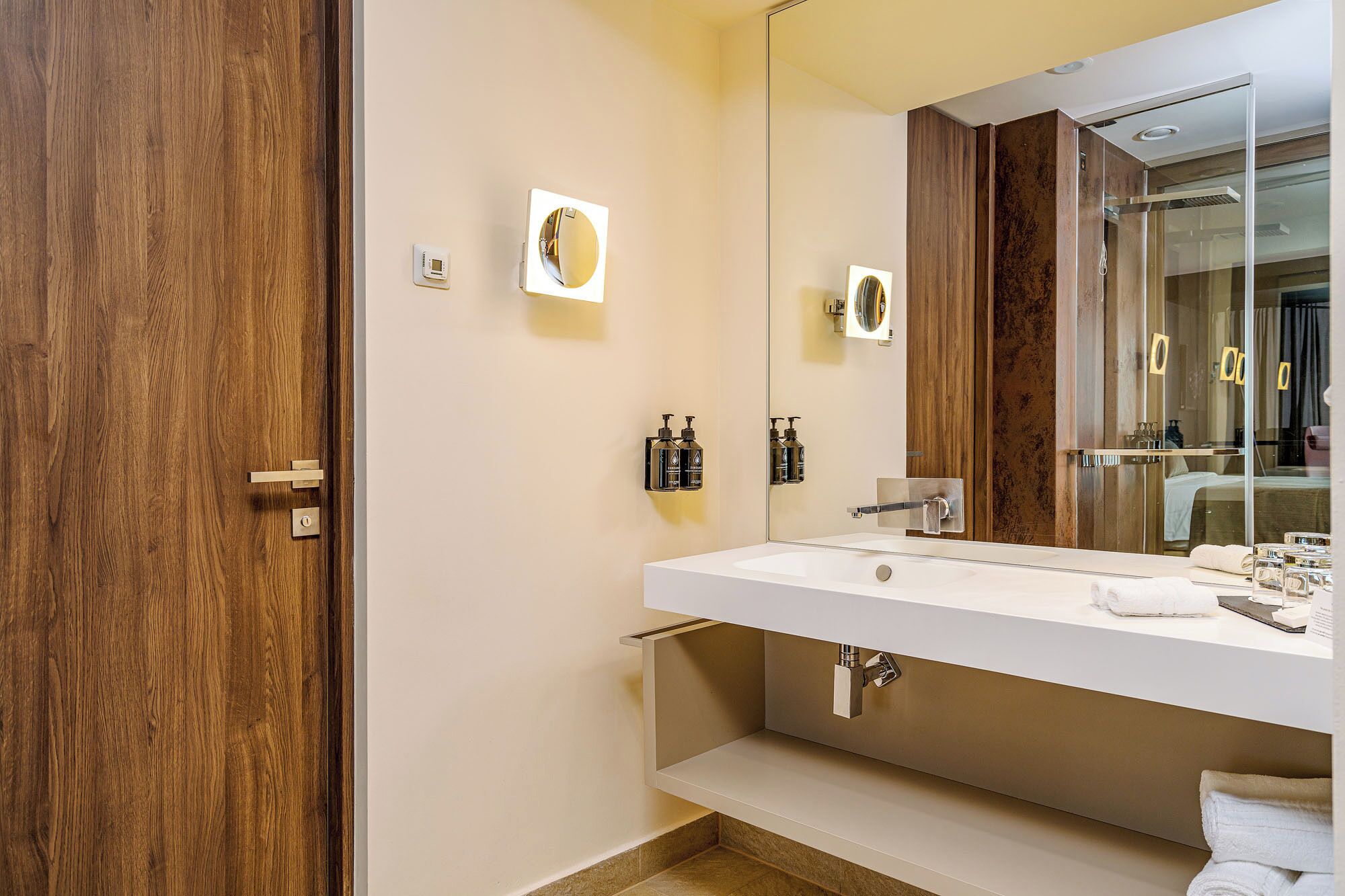 business double or twin room | bathroom | rainfall showerhead, designer toiletries, hair dryer, bathrobes