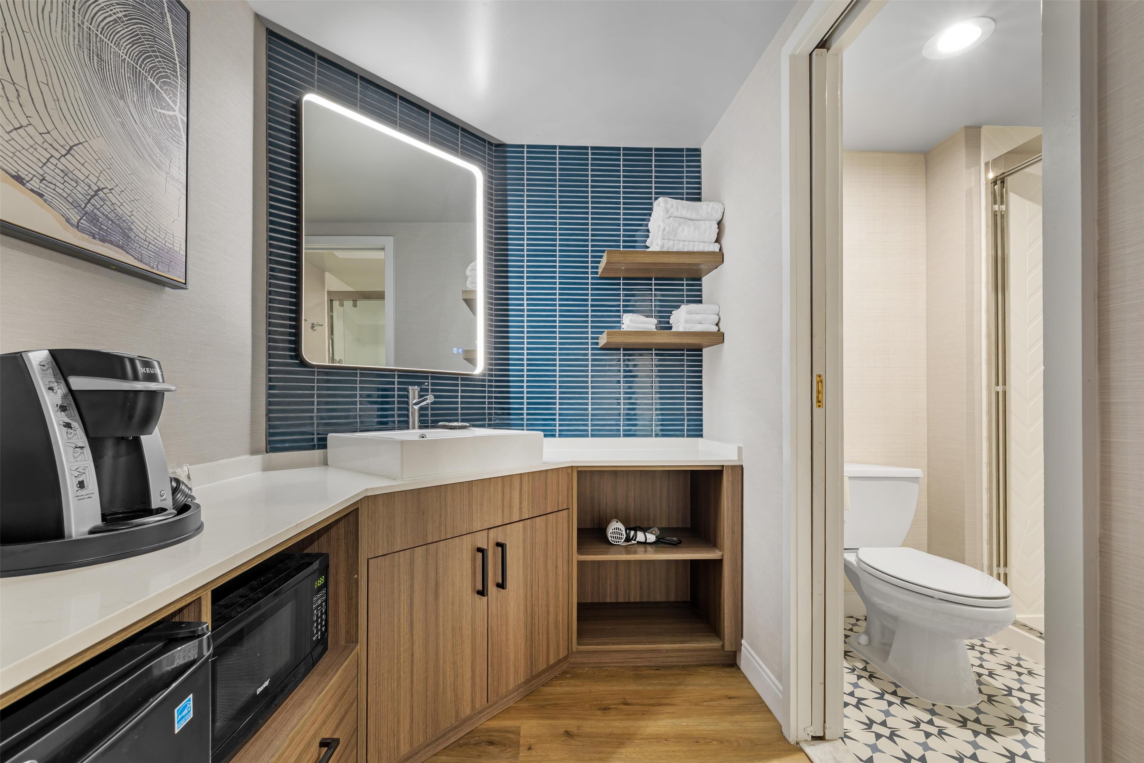 combined shower/bathtub, rainfall showerhead, designer toiletries