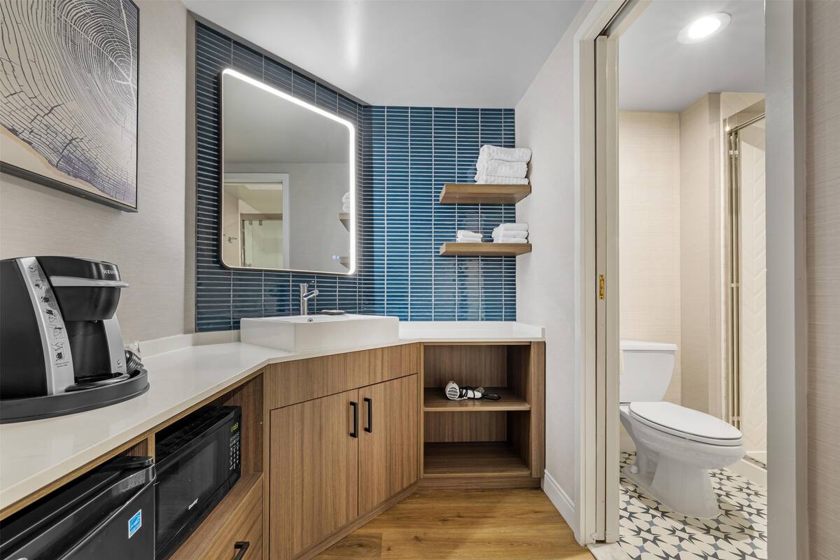 combined shower/bathtub, rainfall showerhead, designer toiletries