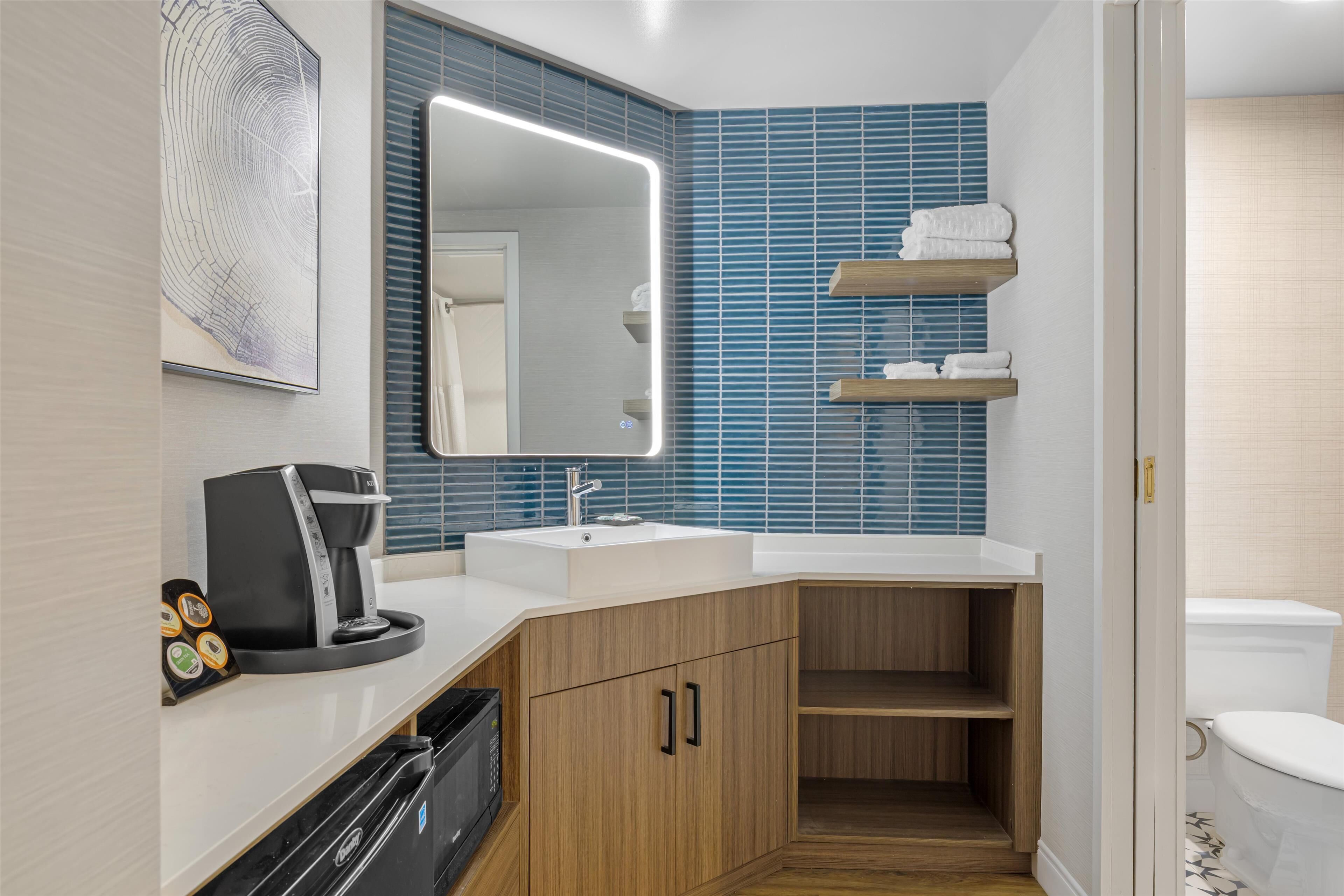 combined shower/bathtub, rainfall showerhead, designer toiletries