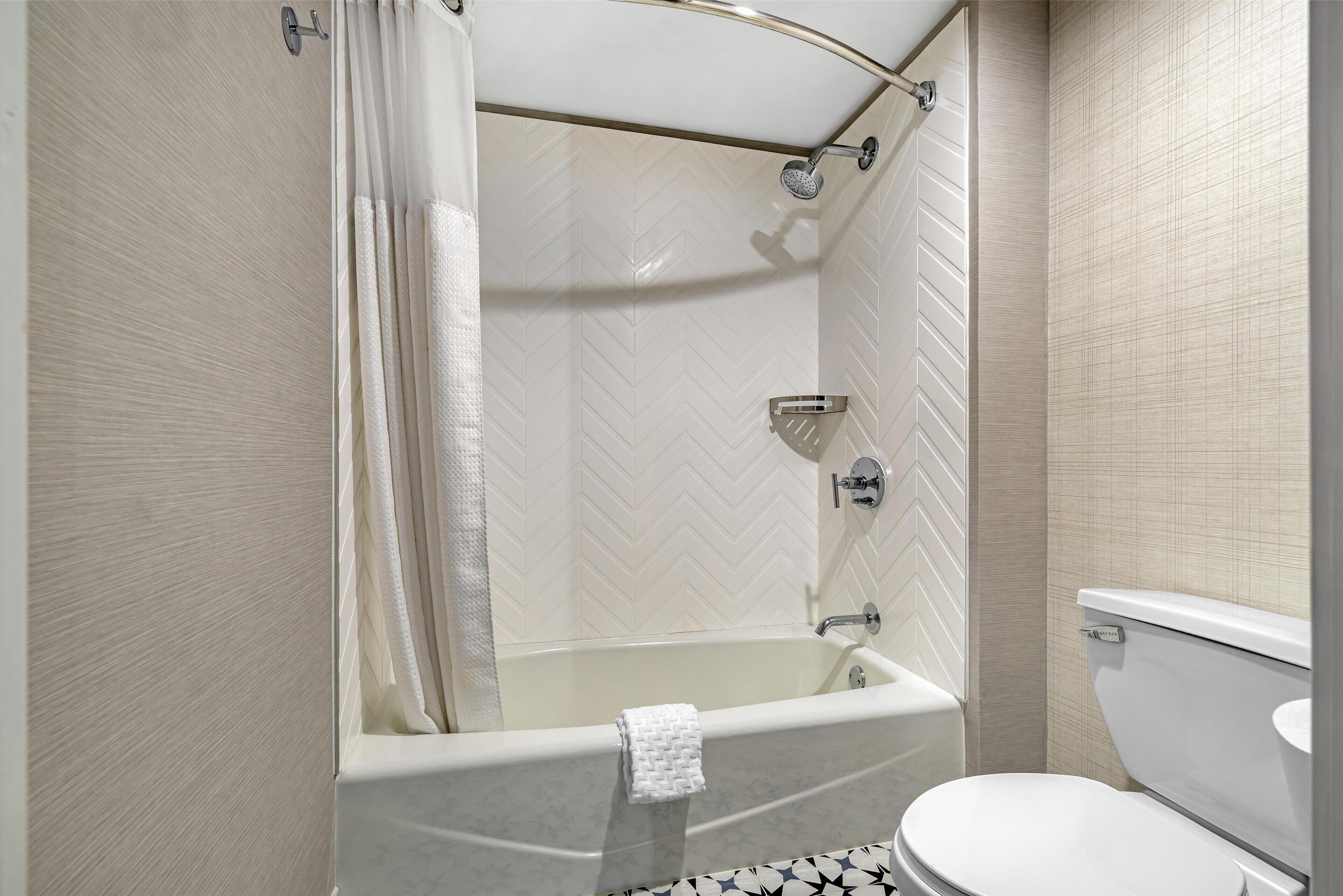 combined shower/bathtub, rainfall showerhead, designer toiletries