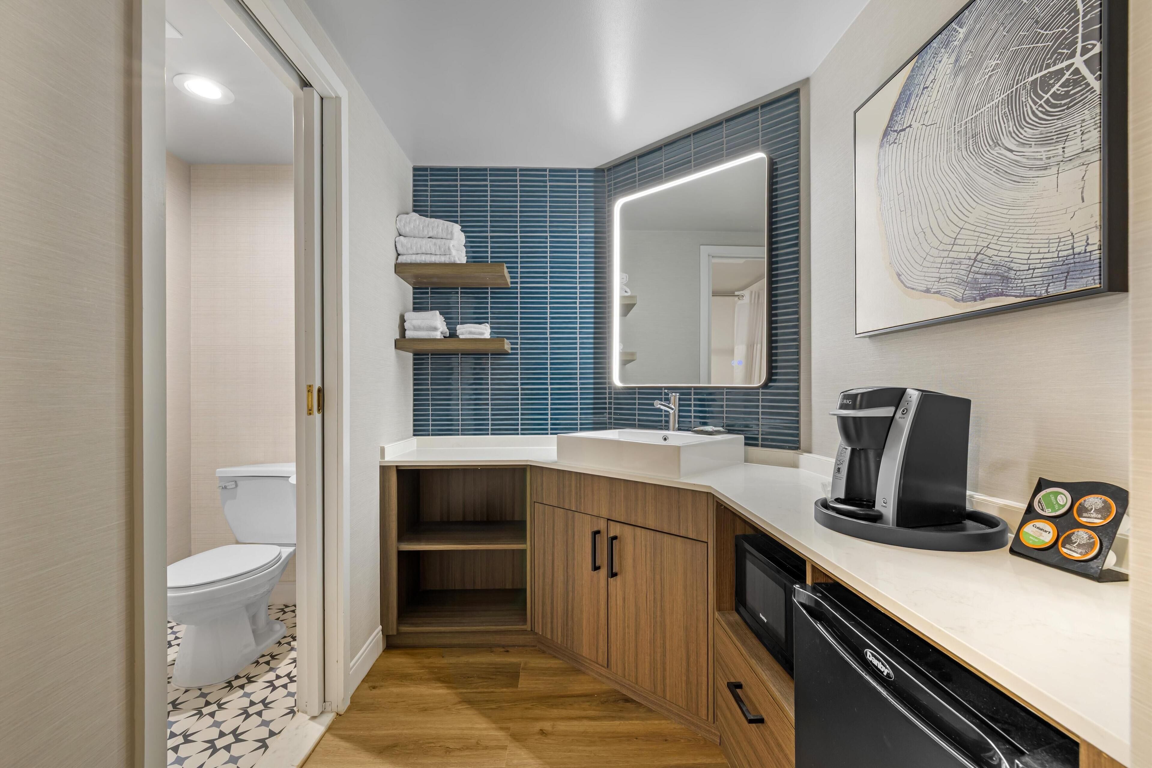 combined shower/bathtub, rainfall showerhead, designer toiletries