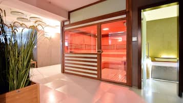 A modern hotel lobby with a reception desk, a large potted plant, and a glass door leading to a room with a red interior.