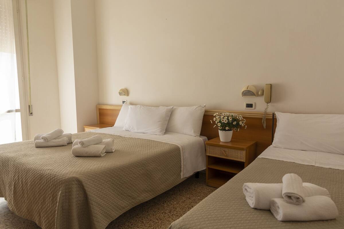 Triple Room, Balcony | In-room safe, desk, free WiFi, bed sheets