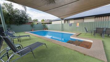 Seasonal outdoor pool, open 8:00 AM to 8:00 PM, pool umbrellas
