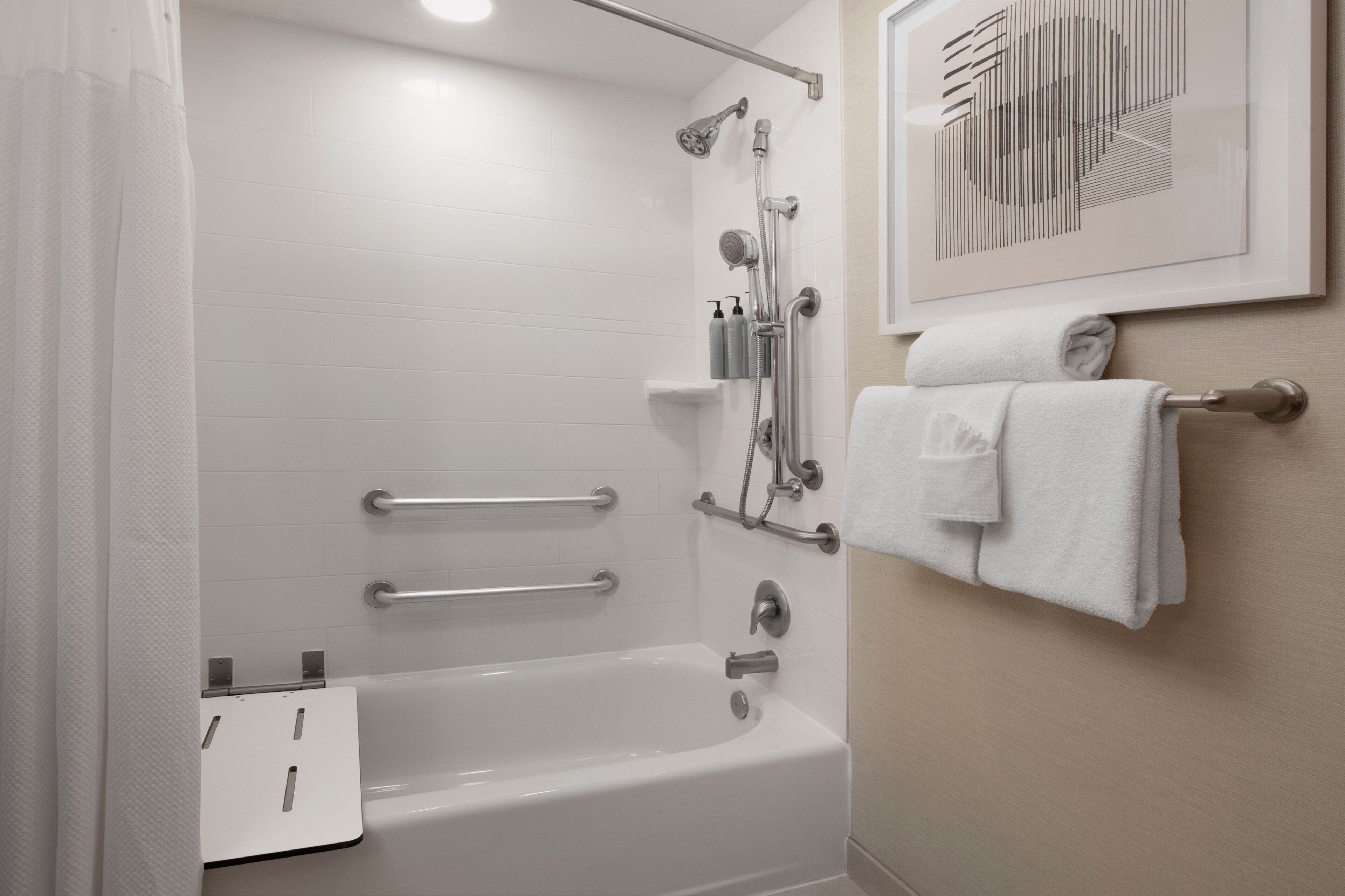 room, 1 king bed, non smoking, pool view | bathroom | combined shower/bathtub, hair dryer, towels