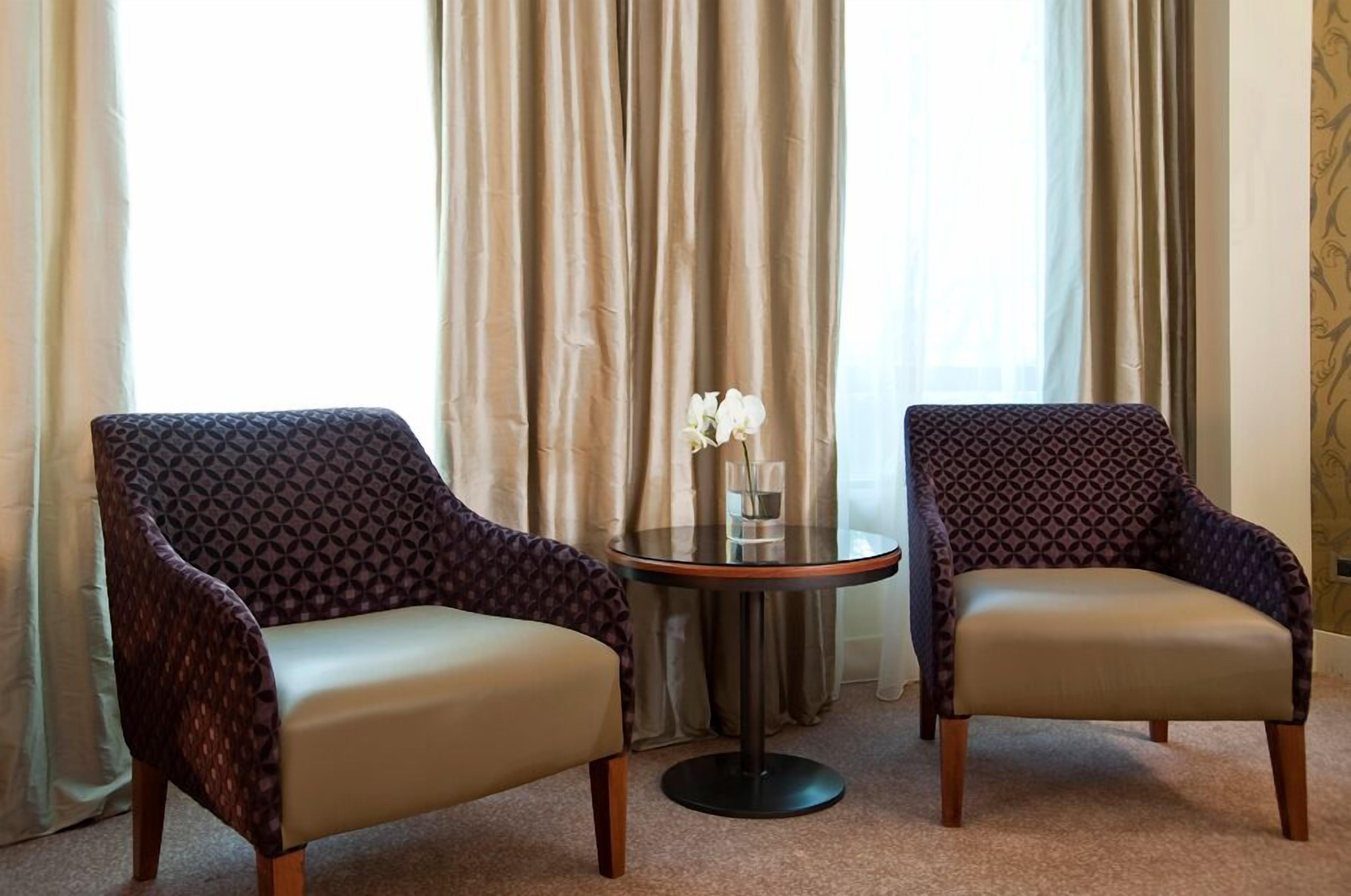 junior suite | living area | 42-inch lcd tv with cable channels, tv, ipod dock