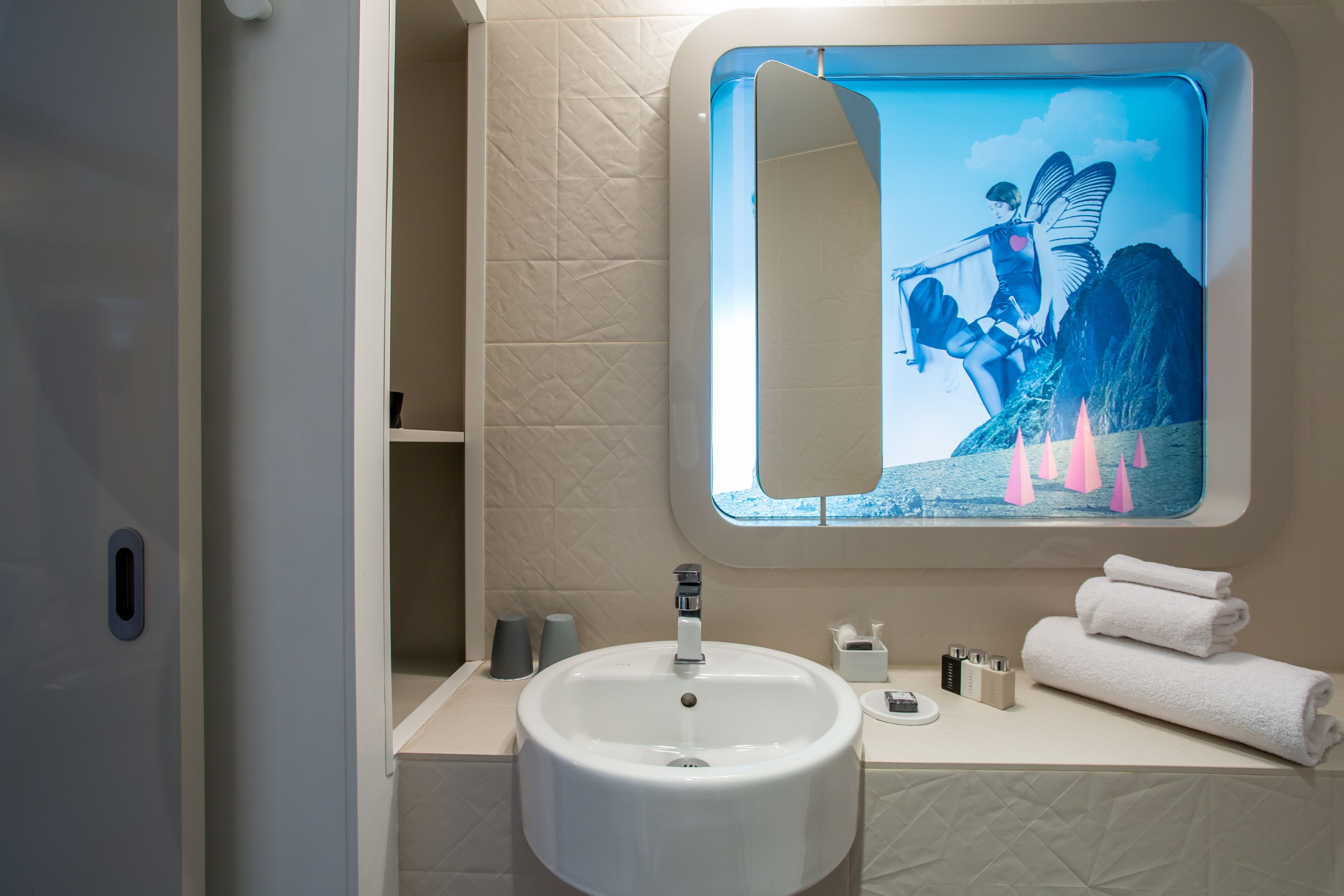 designer toiletries, hair dryer, dressing gowns, towels