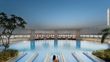 Outdoor pool, open 6 AM to 8 PM, pool umbrellas, sun loungers