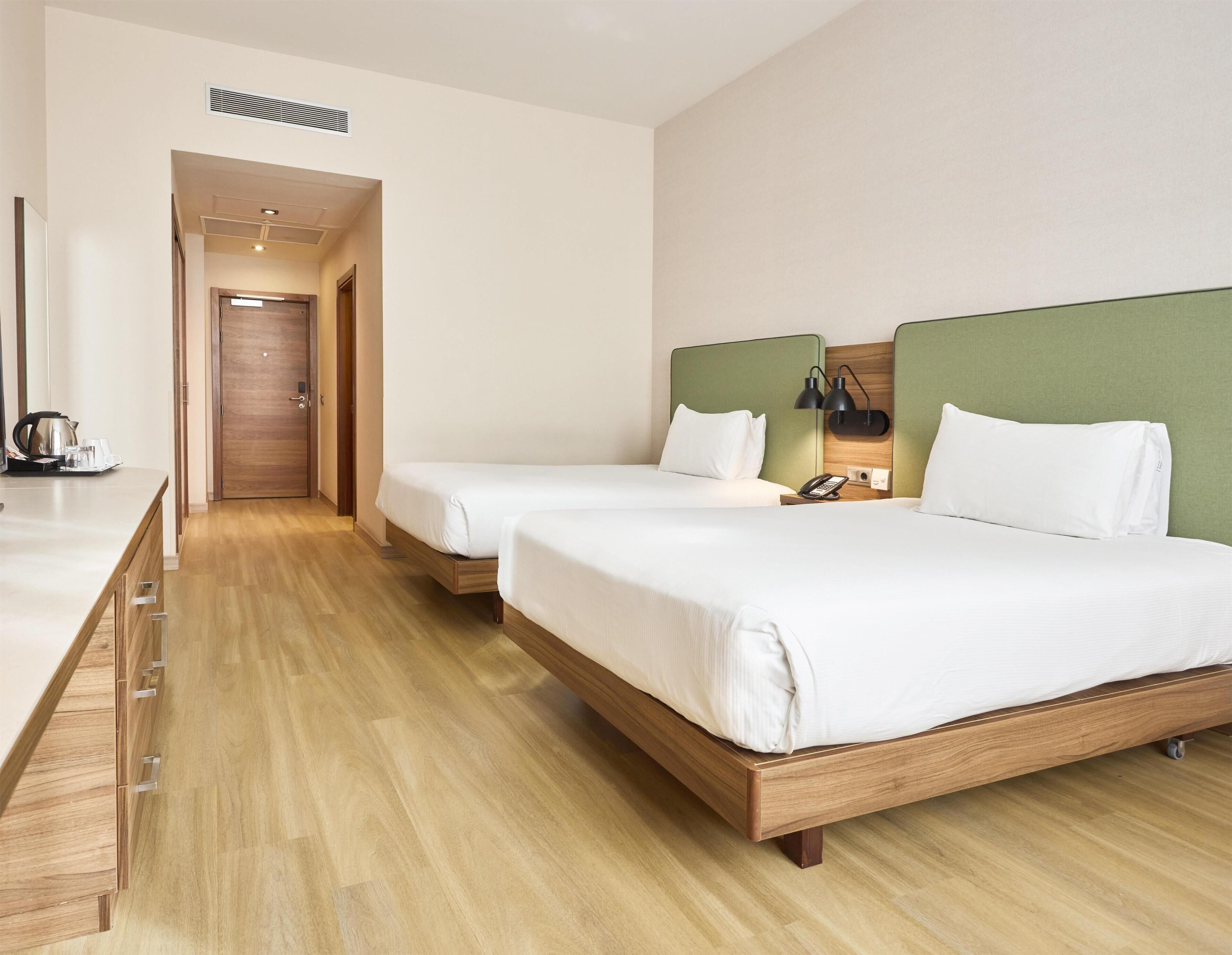 Family Room, 2 Double Beds | In-room safe, blackout drapes, soundproofing, iron/ironing board