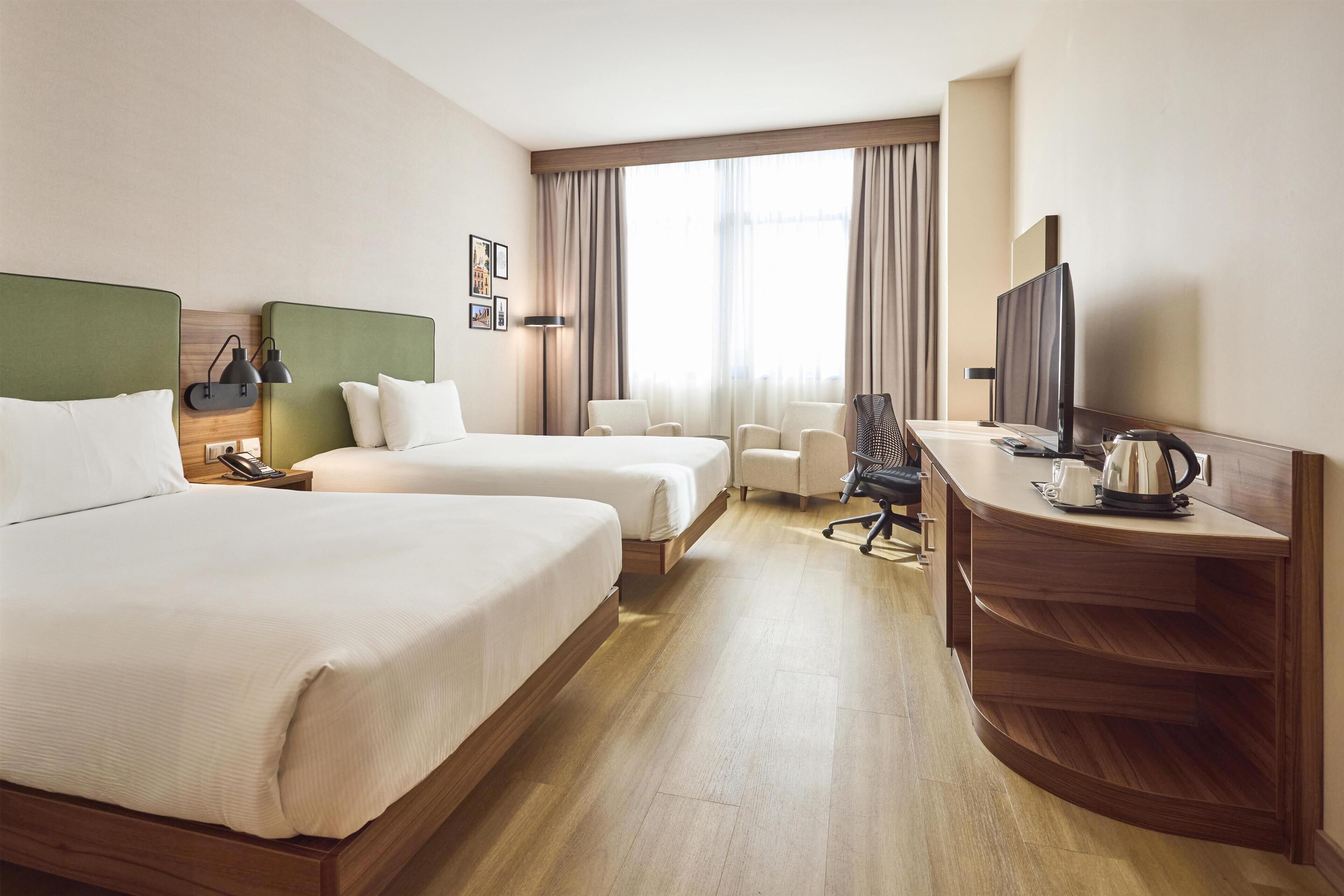 Family Room, 2 Double Beds | In-room safe, blackout drapes, soundproofing, iron/ironing board