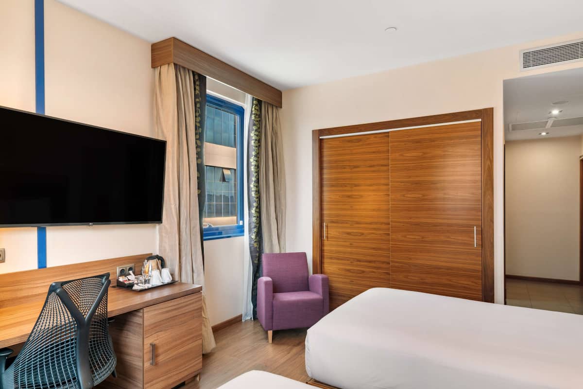 twin room, 2 single beds | in-room safe, blackout curtains, soundproofing, iron/ironing board