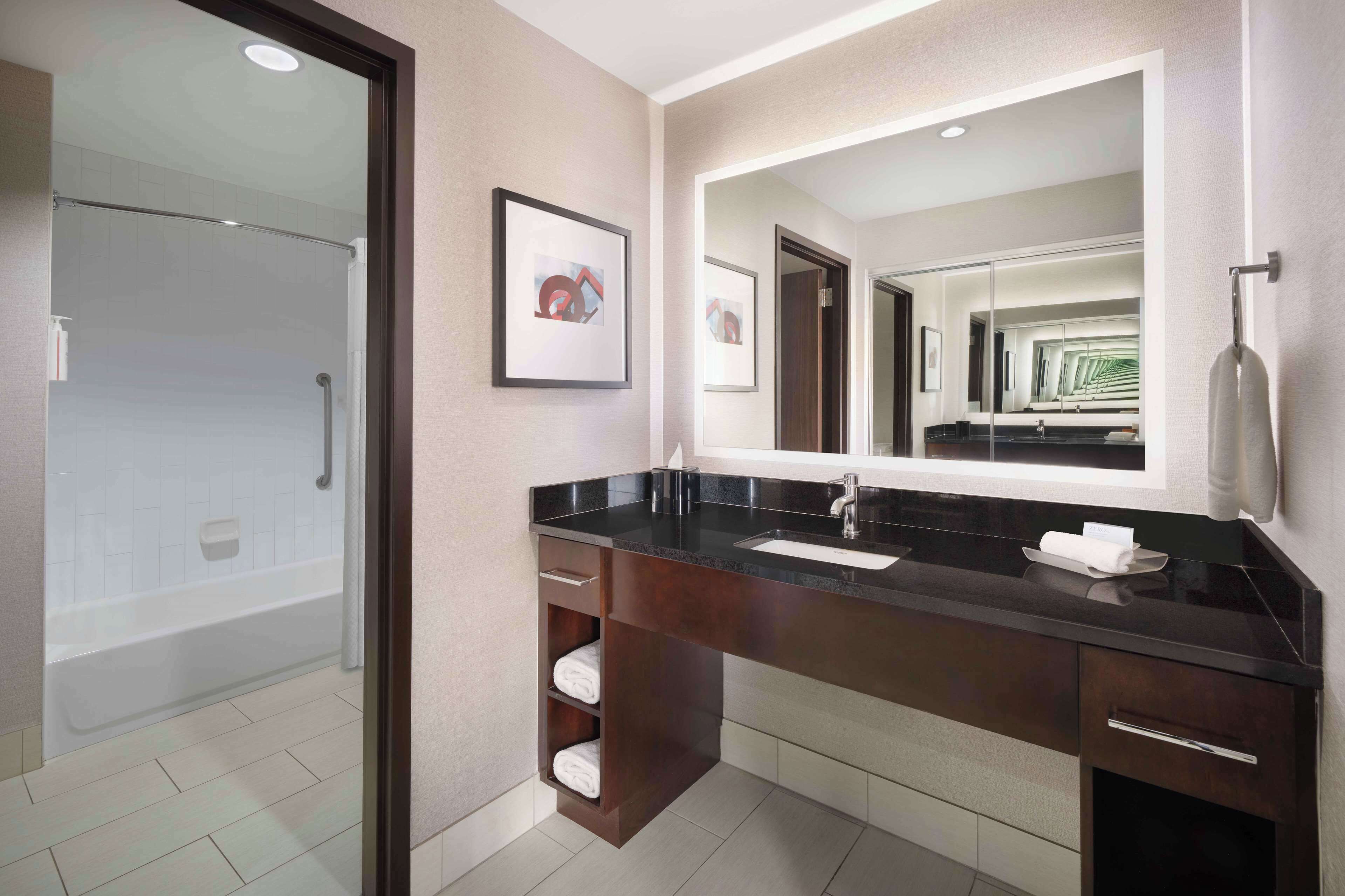 combined shower/bathtub, hair dryer, bathrobes, towels